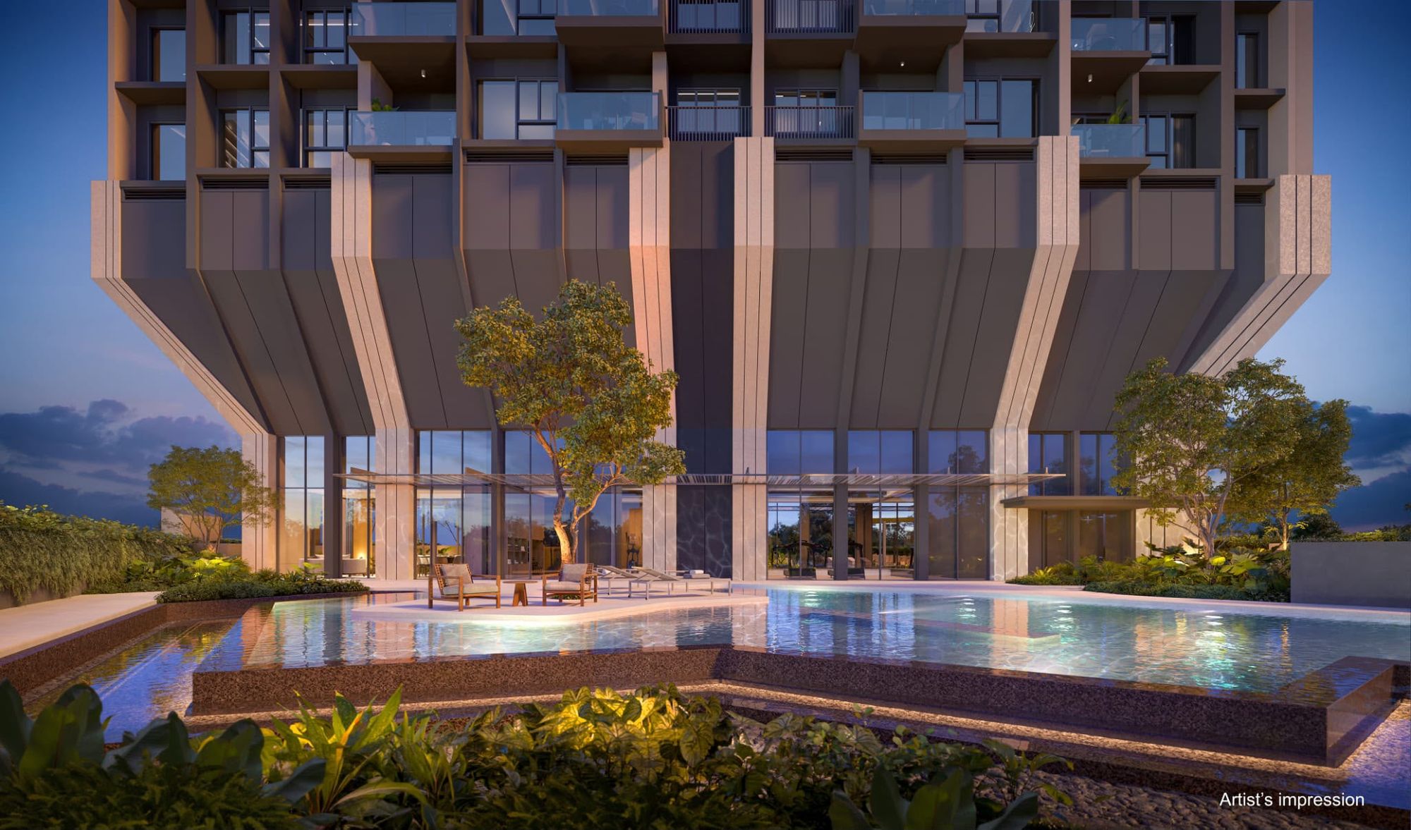 Lap pool at the foot of the tower at dusk